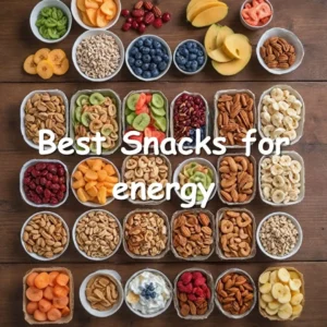 A selection of healthy snacks including fresh fruit, mixed nuts, whole-grain crackers, and hummus on a kitchen counter.
