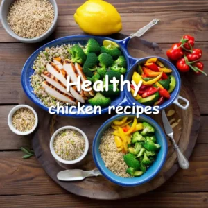 Healthy chicken meal with grilled chicken breasts, colorful vegetables, and quinoa on a rustic wooden table.