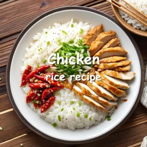 A steaming plate of golden-brown chicken slices served on fluffy jasmine rice, garnished with fresh scallions and toasted sesame seeds, with a side of chili sauce in a cozy kitchen setting.
